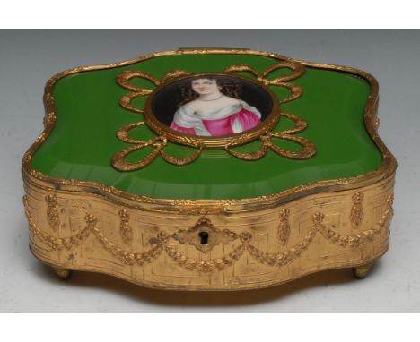 A French porcelain and jade glass mounted gilt metal shaped serpentine casket, hinged cover applied with a circular plaque pa