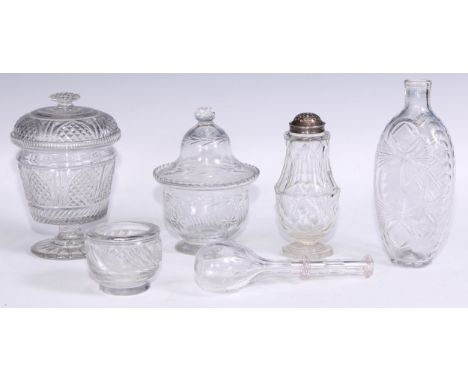 An early 19th century cut glass flask, rough pontil to base, 18cm high; a 19th century toddy lifter, 17.5cm high; a cut glass