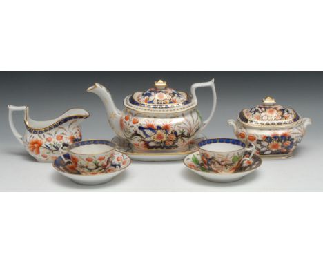 A Coalport tea service, comprising boat shaped teapot, stand and cover, sucrier and cover, milk jug and two teacups and sauce