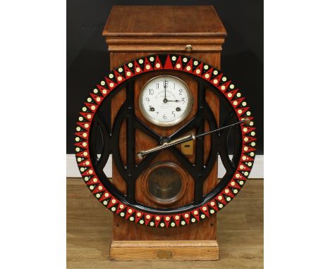 An early 20th century American oak 100 employee industrial dial recorder or clocking-in machine, marketed by Howard Brothers,
