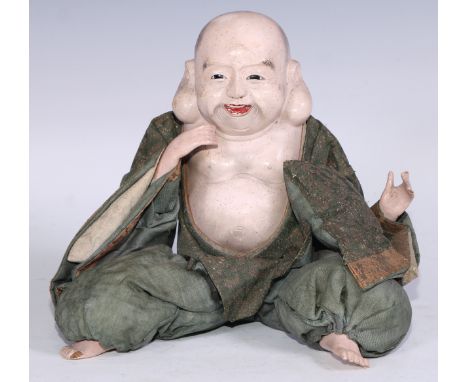 A Chinese composite doll, of a Buddha, in traditional dress, 20cm high, early 20th century 