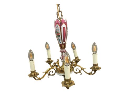 BOHEMIAN CRANBERRY GLASS MOUNTED BRASS FIVE-BRANCH CHANDELIER, the column cased and cut with opaque glass, three panels hand 