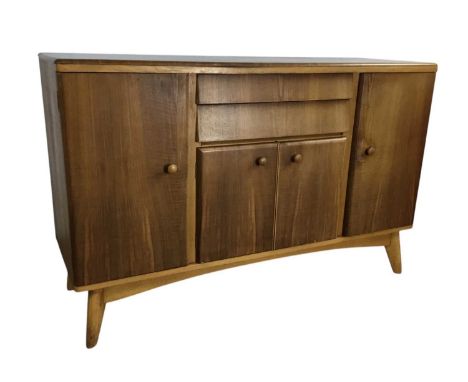 NATHAN FURNITURE, TEAK SIDEBOARD, 1950-59 with two cupboard doors flanking two short drawers over two small cupboard doors, o