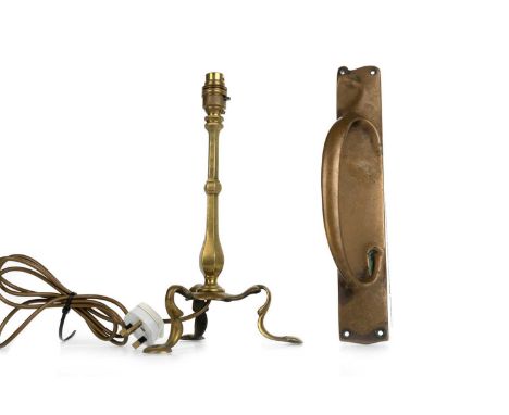 IN THE MANNER OF W.A.S. BENSON, BRASS PULLMAN LAMP, AND AN ART NOUVEAU BRASS DOOR PULL the lamp on tripod feetlamp 33cm high 