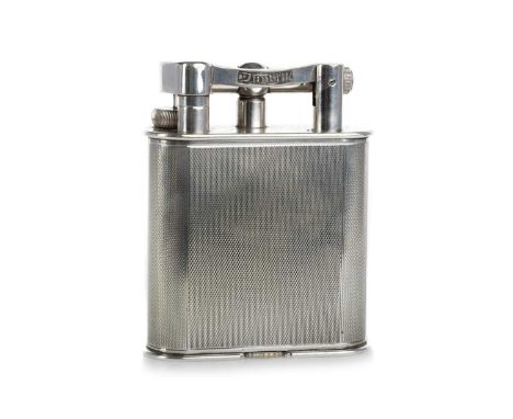 DUNHILL, SILVER PLATED TABLE LIGHTER, 1960-79 pat number 390107, engine turned body10.5cm high Striker rotates. Will need fue