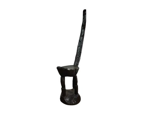 AFRICAN CARVED WOOD SEAT, LATE 19TH /EARLY 20TH CENTURY with oval seat and on tripod column supports 116cm high