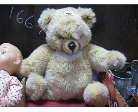 A Modern Steiff Molly Bear, soft bodied, cream plush with white chest, overall length 56cm.