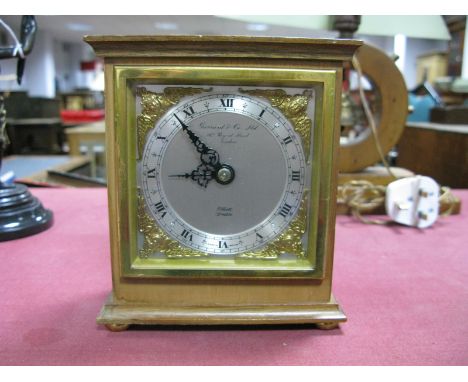 An Elliott of London Mantel Clock, mahogany cased, silvered dial, cast brass spandrels, Arabic numerals, printed Garrard &amp