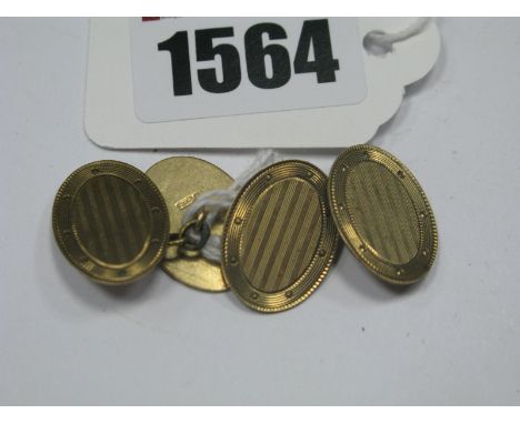 A Pair of Chester Hallmarked 9ct Gold Gent's Cufflinks, the oval engine turned panels on chain connections.