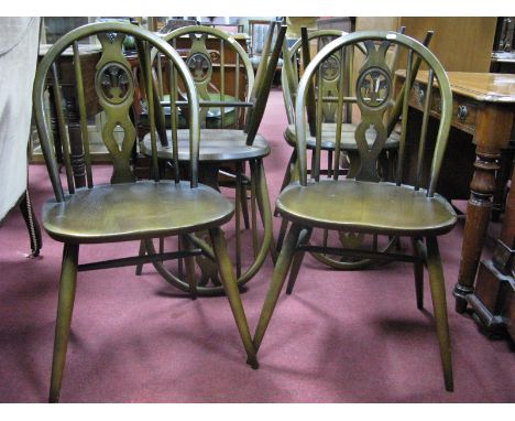 A Set of Six, Dark Ercol Dining Chairs, with hoped back, shaped splat's, on swept legs. (6)