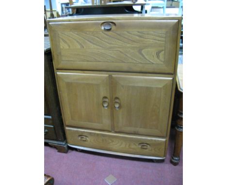  Ercol Writing Cabinet, with a fall front, twin cupboard doors, over a single drawer.