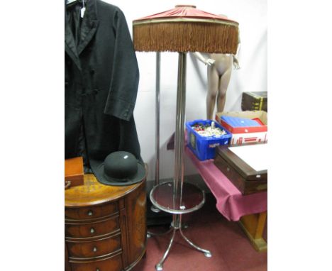 A 1930's Chrome Standard Lamp, having four tubular stem, expanding to circular knop and splaying legs, with central Bakelite 