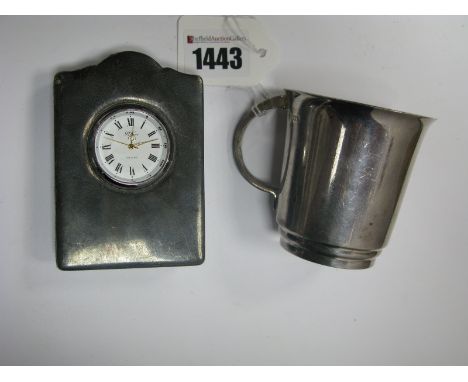 A Hallmarked Silver Mug, Sheffield 1978, of plain form; together with a hallmarked silver mounted desk clock, on plush easel 