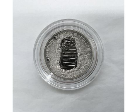 San Francisco Mint. A Commemorative issued coin. The obverse side features a shoe print on the lunar surface. The reverse sid