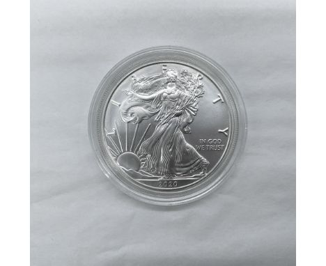 West Point Mint. The obverse side features full length of Liberty in stride. She is shown wrapped in the folds of the flag of