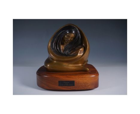 A striking bronze sculpture titled "Harmony" by James Roybal, depicting a serene, flowing figure. The piece, numbered 2/30 an