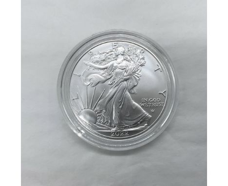 West Point Mint. The obverse side features full length of Liberty in stride. She is shown wrapped in the folds of the flag of