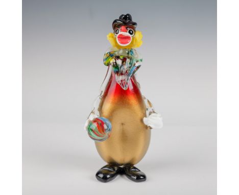 This unique handblown Murano glass clown figurine features vibrant colors and intricate detailing. The clown is dressed in a 