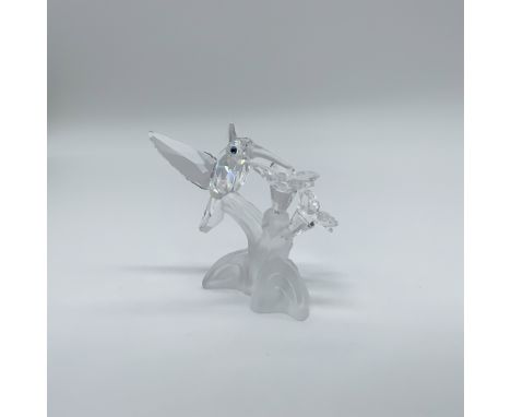 This retired Swarovski crystal figurine features a delicate hummingbird from the "Among Flowers and Foliage" collection, late