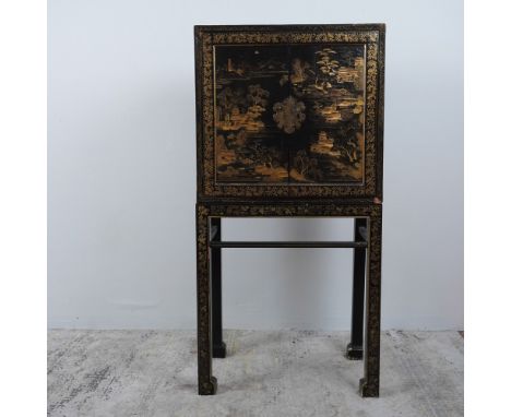 This exquisite antique Asian lacquered cabinet is a remarkable example of traditional craftsmanship, featuring a meticulously