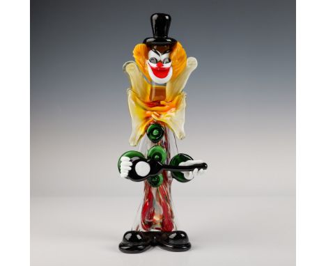 This striking Murano glass clown figurine stands 12.5''H and showcases vibrant colors and intricate detailing, characteristic