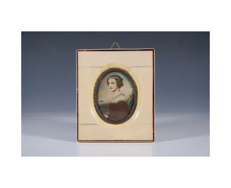 This exquisite antique hand-painted miniature portrait features a finely detailed depiction of a noblewoman, framed in an ele