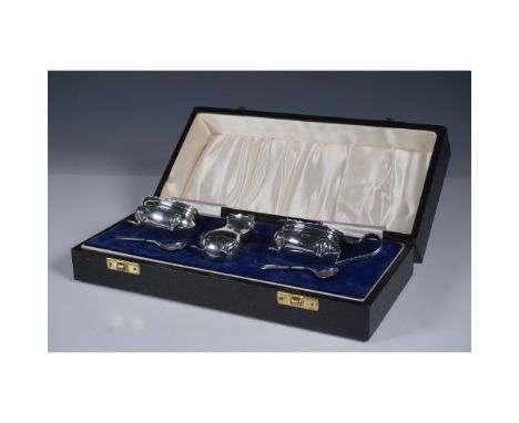 A sterling silver condiment set by A Chick &amp; Sons Ltd, hallmarked London, 1979. The set comprises a pepper shaker, an ope