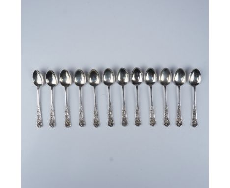 A beautiful set of 12 espresso spoons crafted in Silver 950. These elegant spoons feature intricate floral designs with a hin