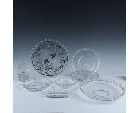 Elegant clear glass with looped edge design. Lot includes platter with silver overlay design (14"); large, rimmed serving bow