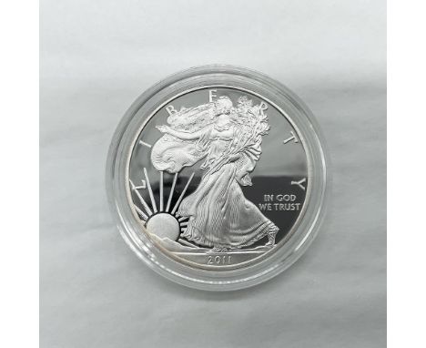 West Point Mint. The obverse side features full length of Liberty in stride. She is shown wrapped in the folds of the flag of