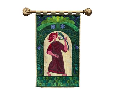A vibrant textile artwork by Israeli artist Kopel Gurwin (1932-1990), featuring a stylized depiction of a woman holding a bra