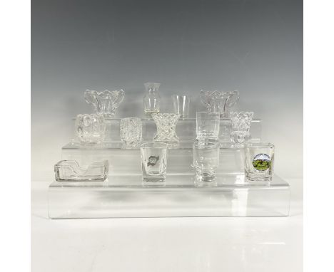 A set of 13 clear glass toothpick holders, some smooth and some featuring abstract low relief art, including a squared holder