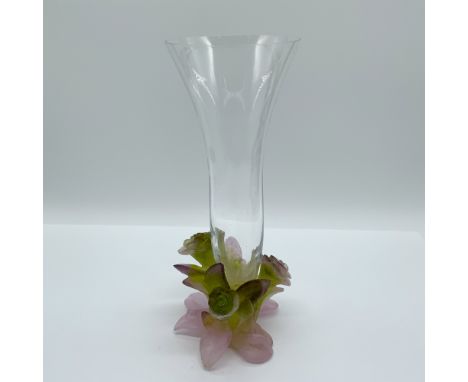 A stunning Daum crystal vase featuring an elegant flared design and a sculptural floral base in hues of pink and green. The b