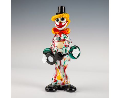 This vibrant Murano glass clown figurine stands at 9.5" tall. The figurine showcases a playful, multi-colored design, featuri