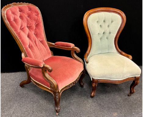 A Victorian walnut balloon back nursing armchair, pink velvet button back upholstery, carved top rail and arms, carved cabrio