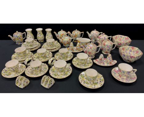 Floral tea ware by Wade including; Vintage purple thistle pattern plates, Chintz style ware including tea pots, sugar bowls, 