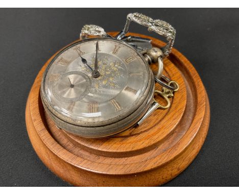 A Victorian silver pocket watch, floral silver dial, raised Roman numerals, subsidiary seconds, key wind fusee movement, 54mm