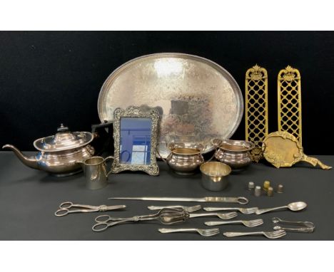 Silver &amp; silver plate - an Edwardian silver mounted arch top photograph frame, Birmingham 1902;  Garrards three piece tea
