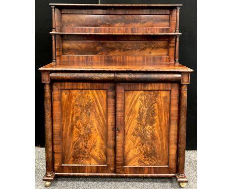 An early Victorian mahogany chiffonier, the superstructure with two shelves, rectangular top above a pair of frieze drawers a