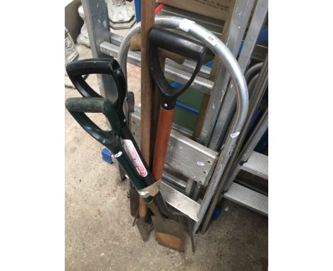 A bundle of gardening tools and small aluminium steps 