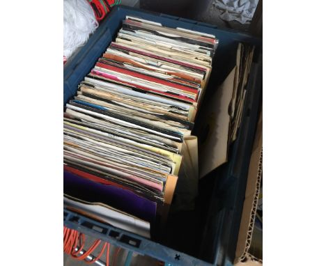 A box of vinyl singles including Beatles, Madonna, Rolling Stones, Michael Jackson, Blondie, The Jam, etc 