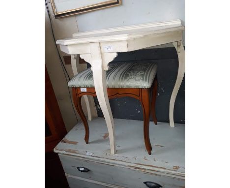 A white painted console table 