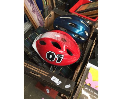 A box of vintage bags and bike helmets 