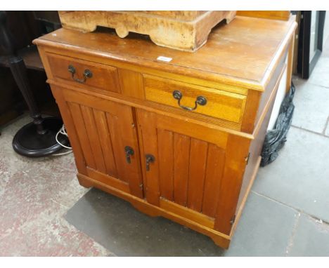 A light oak two drawer cabinet 