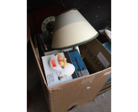 A box of kitchen items to include microwave rice cooker, egg boiler, sandwich maker, a lamp, a clock, etc 
