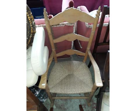 A vintage rush seated rocking chair 