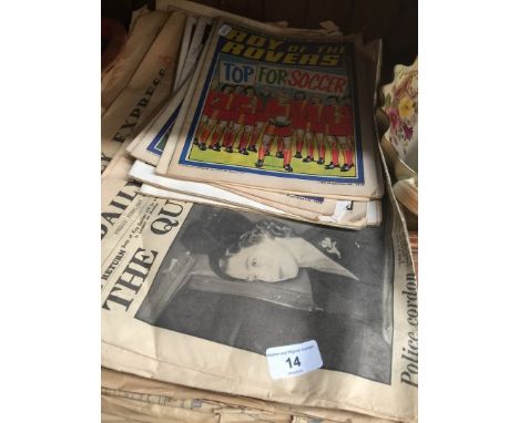 A collection of vintage comics and 1950s newspapers 