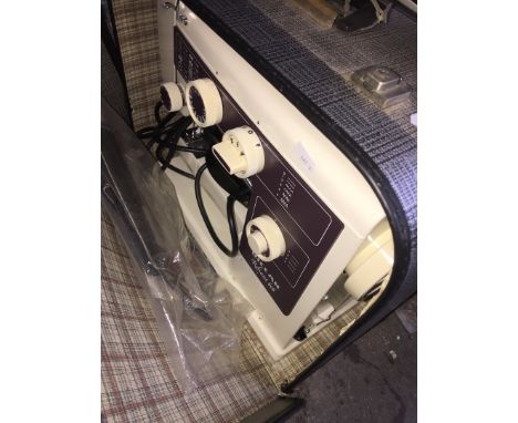 A Riccar Reliant 606 sewing machine with lead, pedal and instructions manual 