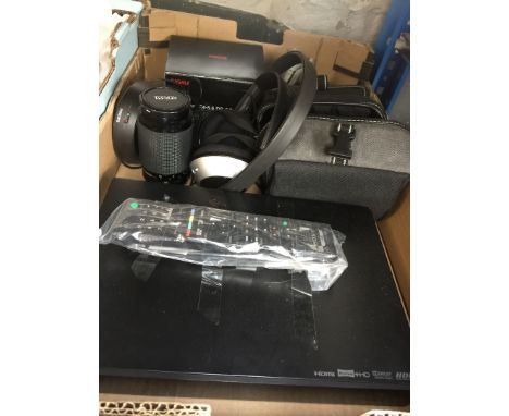 A box containing a HDMI recorder, 2 zoom lenses, wireless headphones, camera in case, etc 