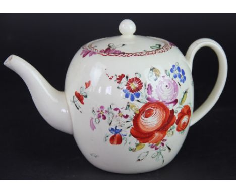 A late 18th century creamware teapot, the bulbous body decorated with floral sprays in russett, puce, cobalt and green, (spou
